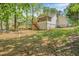 A sprawling backyard with a view of the home's screened porch at 6095 Wayfarer Dr, Villa Rica, GA 30180