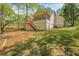 Spacious backyard featuring a screened porch, ideal for enjoying the outdoors at 6095 Wayfarer Dr, Villa Rica, GA 30180