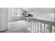 This bonus room includes a window, carpeted floor, and a desk for office use at 6095 Wayfarer Dr, Villa Rica, GA 30180