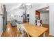 Open dining area with hardwood floors, adjacent to the living room and kitchen at 6095 Wayfarer Dr, Villa Rica, GA 30180