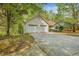 This home includes an attached two-car garage and a large driveway at 6095 Wayfarer Dr, Villa Rica, GA 30180