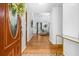 Bright foyer featuring hardwood floors, decorative tiling, and a view into the living room at 6095 Wayfarer Dr, Villa Rica, GA 30180