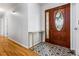 Inviting foyer with hardwood floors and a decorative console table with decorative tiling at 6095 Wayfarer Dr, Villa Rica, GA 30180