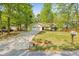 Well-maintained home with a spacious front yard, two-car garage and ample driveway space at 6095 Wayfarer Dr, Villa Rica, GA 30180