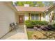 Inviting front porch with decorative bench and a well-manicured garden landscape at 6095 Wayfarer Dr, Villa Rica, GA 30180