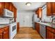 Efficient kitchen layout with cherry cabinets, granite countertops and stainless steel appliances at 6095 Wayfarer Dr, Villa Rica, GA 30180