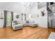 Bright living room featuring hardwood floors and a cozy sectional couch at 6095 Wayfarer Dr, Villa Rica, GA 30180
