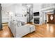 Open-concept living room with hardwood floors, a fireplace and spiral staircase at 6095 Wayfarer Dr, Villa Rica, GA 30180