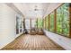 This screened porch is roomy, bright and features wood floors at 6095 Wayfarer Dr, Villa Rica, GA 30180