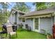 The rear patio has artificial grass and an awning covered door, perfect for outdoor relaxation at 127 Stagecoach Trl, Stockbridge, GA 30281