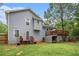 Backyard view of home featuring a deck, storage, wooden fence, and mature trees at 127 Stagecoach Trl, Stockbridge, GA 30281