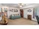 Finished basement with a comfortable seating area, decor, and office space at 127 Stagecoach Trl, Stockbridge, GA 30281