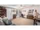 Spacious finished basement with carpet flooring, a work station, and a comfortable sitting area at 127 Stagecoach Trl, Stockbridge, GA 30281