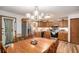 Eat-in kitchen featuring stainless steel appliances, wood cabinets, and hardwood floors at 127 Stagecoach Trl, Stockbridge, GA 30281