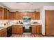 Traditional kitchen features wood cabinets, laminate countertops, and stainless steel appliances at 127 Stagecoach Trl, Stockbridge, GA 30281