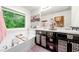 Bathroom featuring double sinks, stylish cabinets, and a garden tub near a window at 236 Bobbie Way, Woodstock, GA 30189