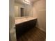 Well-lit bathroom with a long vanity, spacious mirror, and modern fixtures at 236 Bobbie Way, Woodstock, GA 30189
