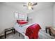 Cozy bedroom with a plaid blanket and decorative wall art at 236 Bobbie Way, Woodstock, GA 30189