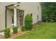 Exterior side view of home showcasing well-manicured landscaping and architectural detail at 236 Bobbie Way, Woodstock, GA 30189