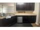 Galley kitchen with stainless steel appliances and dark cabinetry at 236 Bobbie Way, Woodstock, GA 30189
