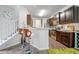 Modern kitchen featuring stainless steel appliances, sleek countertops, and a breakfast bar at 236 Bobbie Way, Woodstock, GA 30189