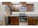 Functional kitchen featuring sleek appliances, ample cabinet space, and efficient layout at 236 Bobbie Way, Woodstock, GA 30189