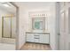 Bathroom features double sinks, a gold trimmed shower stall, and a linen closet at 44 Saint Claire Ne Ln, Atlanta, GA 30324