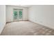 Bedroom with neutral walls, carpet and patio access at 44 Saint Claire Ne Ln, Atlanta, GA 30324