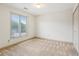 Bedroom featuring a large window, plush carpet, and closet space at 44 Saint Claire Ne Ln, Atlanta, GA 30324