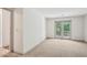 Bright bedroom features neutral carpet and French doors leading to a balcony at 44 Saint Claire Ne Ln, Atlanta, GA 30324
