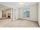 Neutral bedroom with soft carpet, window, and access to fireplace in adjoining room at 44 Saint Claire Ne Ln, Atlanta, GA 30324