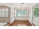 Charming dining nook with hardwood floors and natural light from windows and deck access at 44 Saint Claire Ne Ln, Atlanta, GA 30324