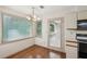 Cozy dining area with hardwood floors, access to deck, and adjacent kitchen space at 44 Saint Claire Ne Ln, Atlanta, GA 30324