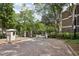 Gated Walden entrance featuring a brick-paved driveway for controlled access to the community at 44 Saint Claire Ne Ln, Atlanta, GA 30324