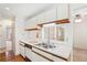 Well-lit kitchen showcasing bright countertops, double sink, and hardwood flooring at 44 Saint Claire Ne Ln, Atlanta, GA 30324