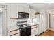 Kitchen area with appliances, wood cabinets, and easy access to the back entry at 44 Saint Claire Ne Ln, Atlanta, GA 30324