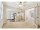 Office area with neutral walls, carpet, fan, natural lighting and glass doors at 44 Saint Claire Ne Ln, Atlanta, GA 30324