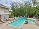 Community pool area with lounge chairs and umbrellas, perfect for relaxation and leisure activities at 44 Saint Claire Ne Ln, Atlanta, GA 30324