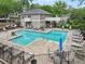 Community pool area with lounge chairs, umbrellas and seating areas for residents and their guests at 44 Saint Claire Ne Ln, Atlanta, GA 30324