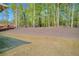 Large lot with grassy area near the home and wooded space beyond at 5003 Fairview Cir, Villa Rica, GA 30180