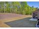 Lawn, patio, and wooded area behind the home at 5003 Fairview Cir, Villa Rica, GA 30180