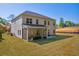 Expansive backyard featuring a screened porch and lush lawn at 5003 Fairview Cir, Villa Rica, GA 30180
