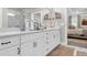 Bathroom vanity with double sinks, modern fixtures, and an adjacent glass shower and closet at 5003 Fairview Cir, Villa Rica, GA 30180