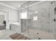 This bathroom features a large glass shower with marble accents and a standalone soaking tub at 5003 Fairview Cir, Villa Rica, GA 30180