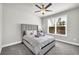 Well-lit bedroom features a large window, ceiling fan and is freshly painted in a neutral color at 5003 Fairview Cir, Villa Rica, GA 30180