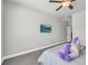 Freshly painted bedroom features a ceiling fan and mounted television at 5003 Fairview Cir, Villa Rica, GA 30180