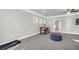 Spacious bedroom with gray walls, a ceiling fan, a small office area, and neutral carpeting at 5003 Fairview Cir, Villa Rica, GA 30180