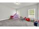 Spacious bonus room features large windows and plenty of space for activities at 5003 Fairview Cir, Villa Rica, GA 30180
