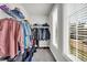 Bright walk-in closet with wire shelving, hanging storage, and natural light from two windows at 5003 Fairview Cir, Villa Rica, GA 30180