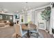 Dining space adjacent to living room features stylish chandelier and modern decor at 5003 Fairview Cir, Villa Rica, GA 30180